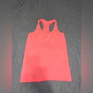 Lululemon Swiftly Tank in a coral/orange color